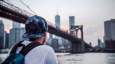 J1 student in new york looking at a bridge in Manhattan