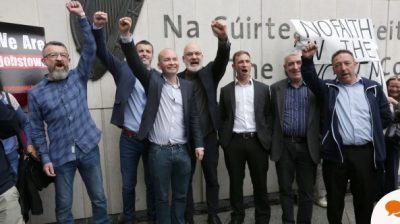 Six men from Jobstown trial raising their hands in the air after found not guilty
