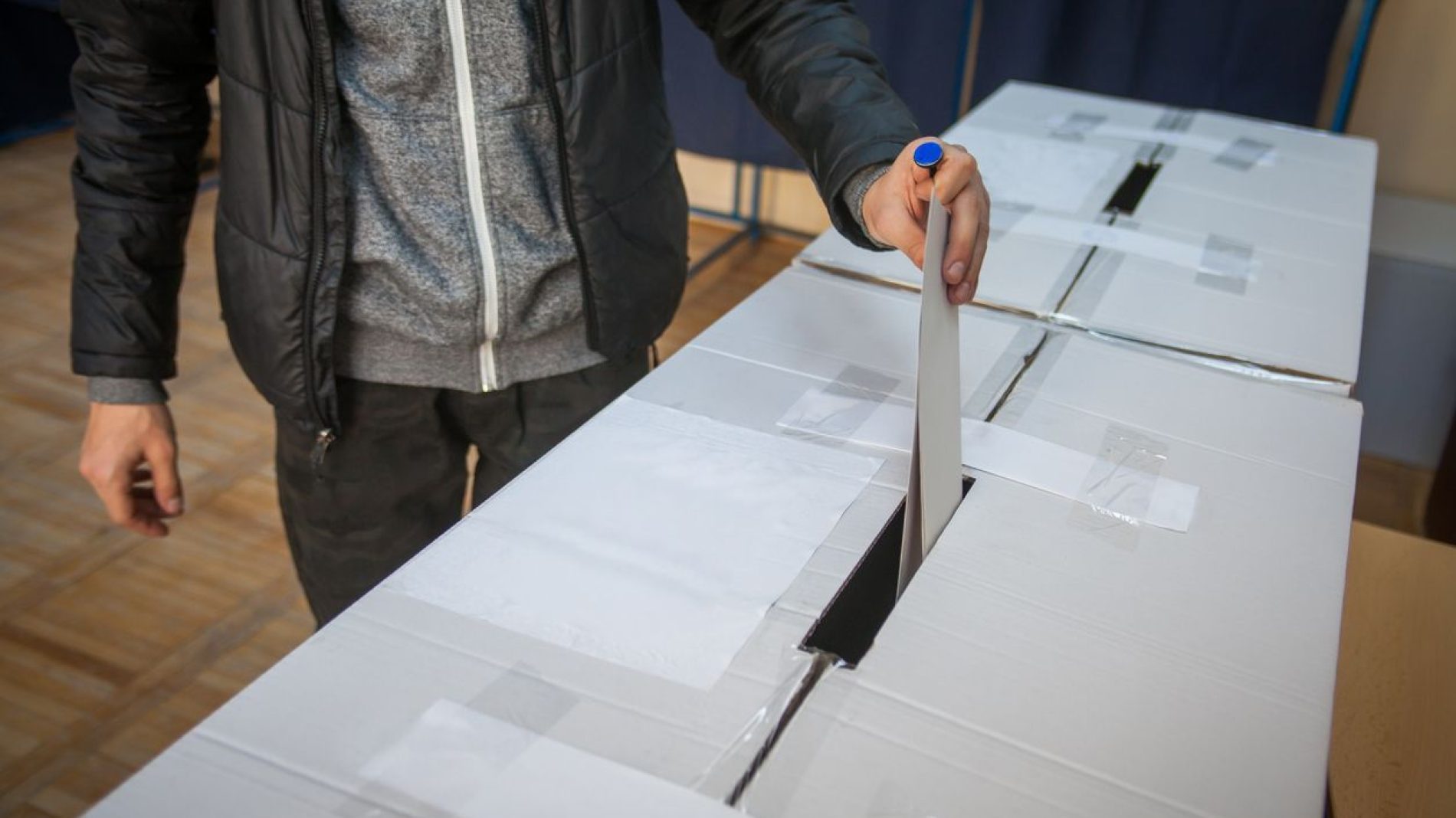 Placing a vote in a ballot box