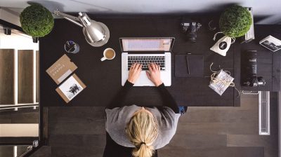 Photo of a person at their desk from above - short term enterprise allowance