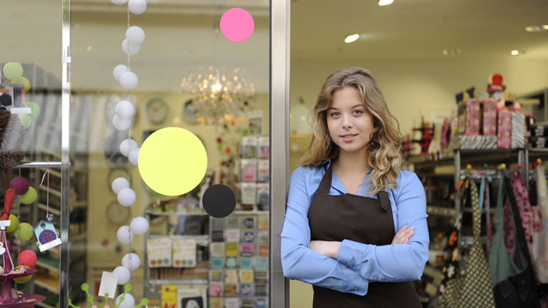 Young woman standing outside of a business