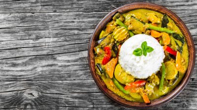 vegetarian curry with rice, coconut, ginger, soy sauce top view