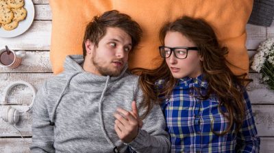 boy and girl lying beside each other