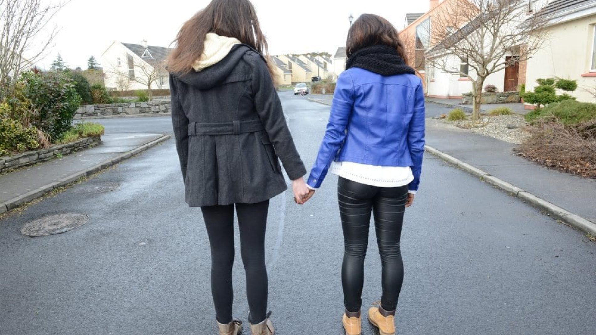 two girls holding hands