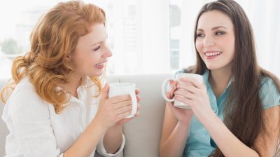 two_women_talking_with_cup_of_tea