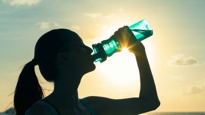 woman drinking a bottle of water