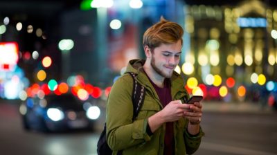 young-man-on-phone-at-night-5dwdWc