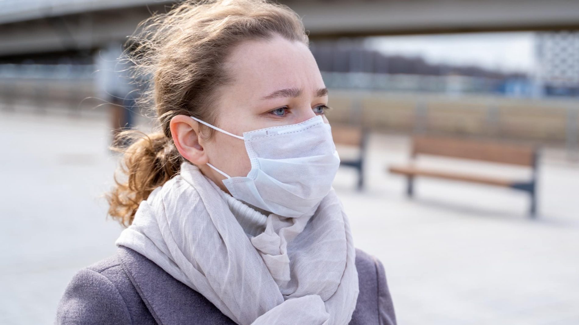Young person outside with a facemask on