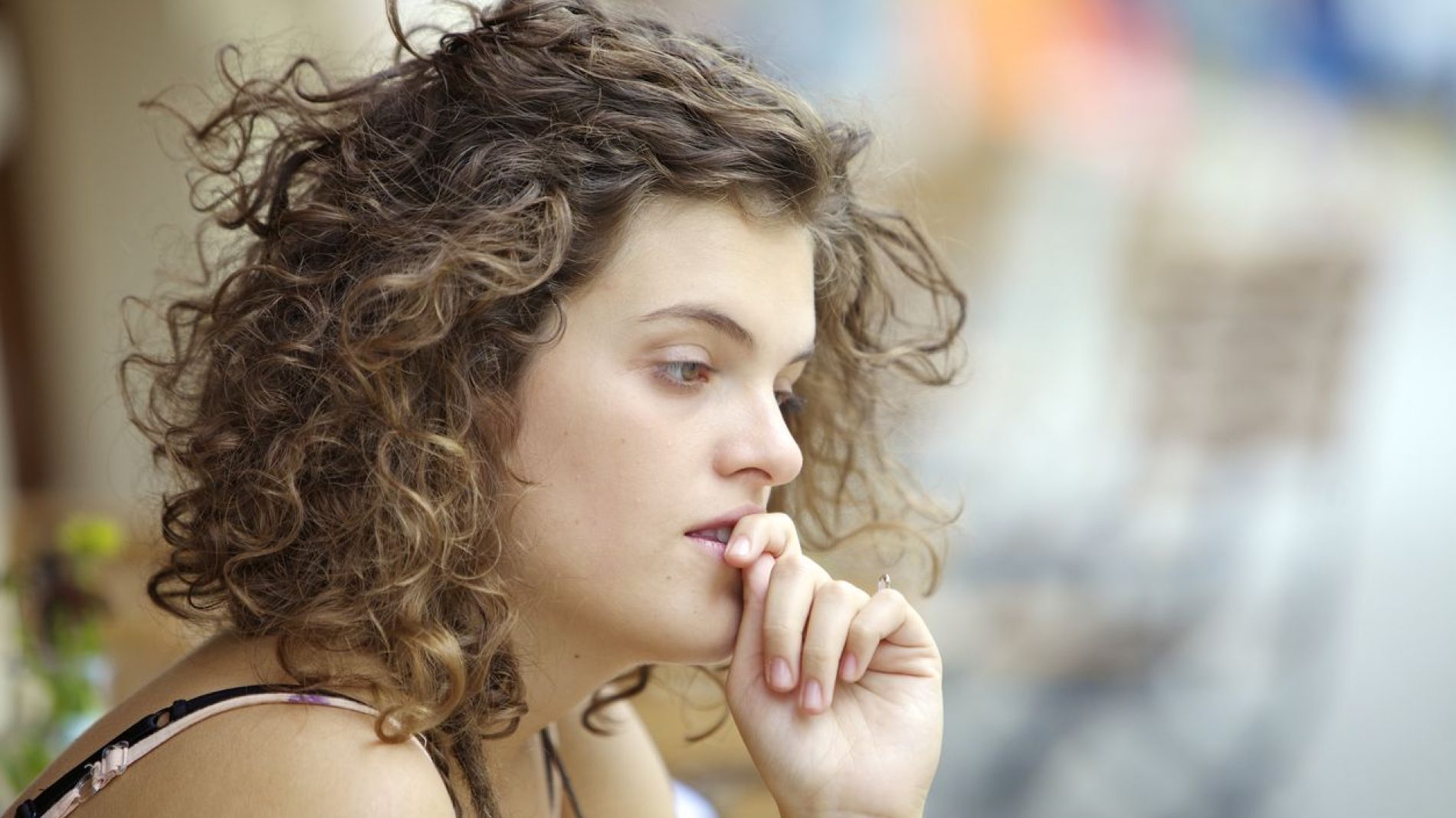 Young woman thinking and looking worried