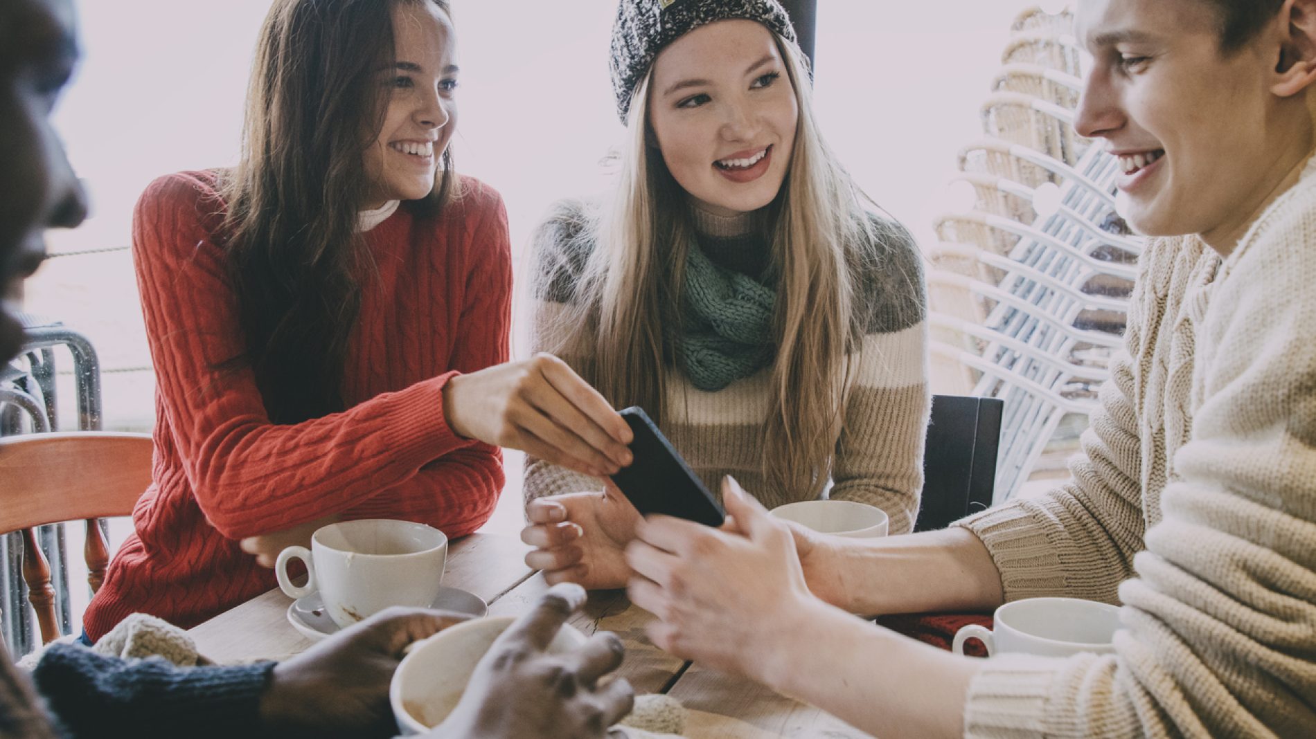 Teenagers In A Cafe In Winter